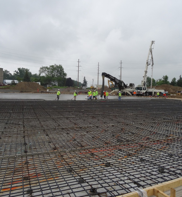 pouring concrete on steel grid photo